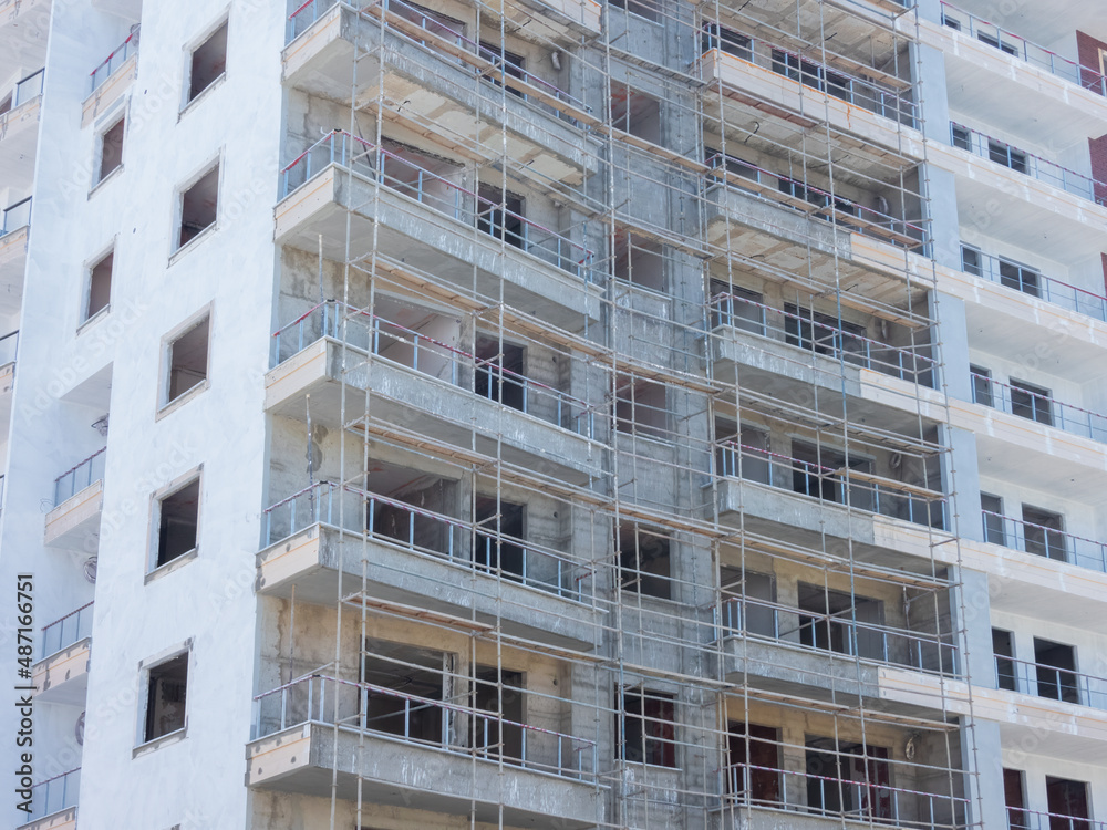 Fototapeta premium Residential building under construction on a sunny day