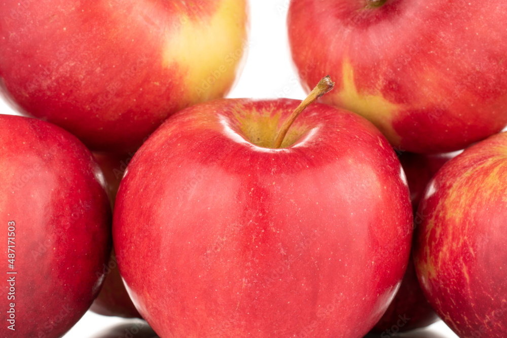 Several ripe red apples, macro, isolated on a white background. Several ripe red apples, macro, isolated on a white background.