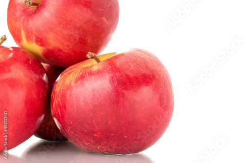 Three ripe red apples  macro  isolated on white background.