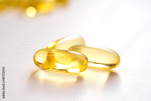 omega 3 vitamins yellow capsules close