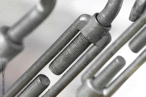 Background from steel turnbuckles, close up. Conception of connection and fastening.