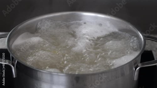 Italian pasta into boiling water. Home cooking concept