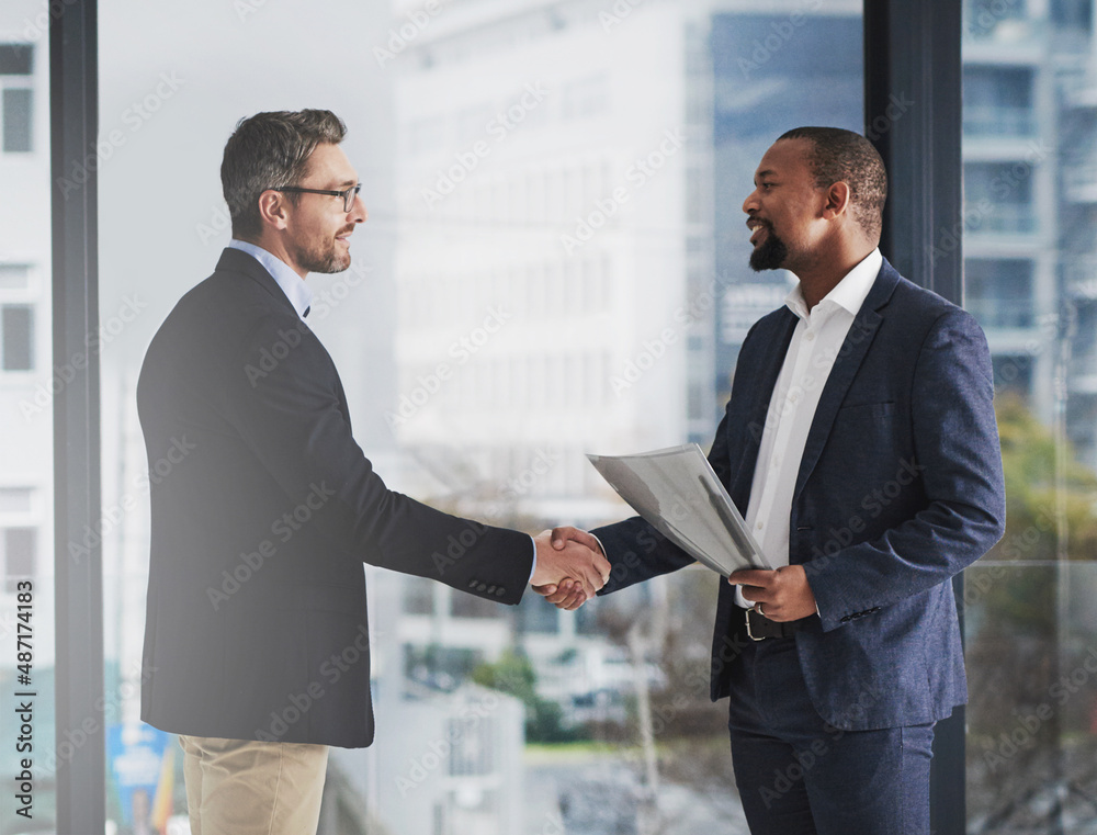 To be the best, partner with the best. Shot of two businessmen shaking hands at work. To be the best, partner with the best. Shot of two businessmen shaking hands at work.