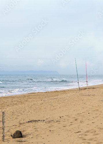 Fishing rods on a beach