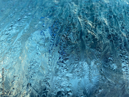 Blue and white Frost on Window in Winter