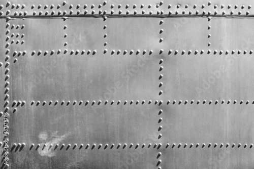 Rivets on Aircraft Fuselage Abstract