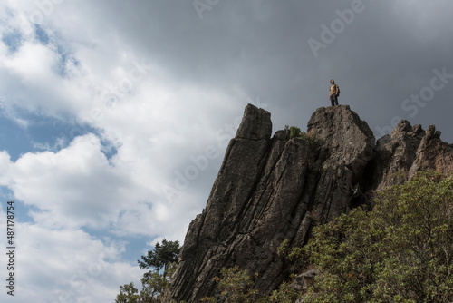 A middle age man on the top of a cliff
