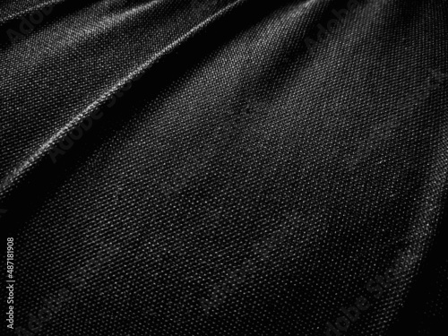 Black fabric pattern texture. Dark abstract wavy background