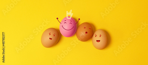 Brown Easter chicken eggs on yellow background. Natural healthy organic food. Top view, flat lay, copy space.