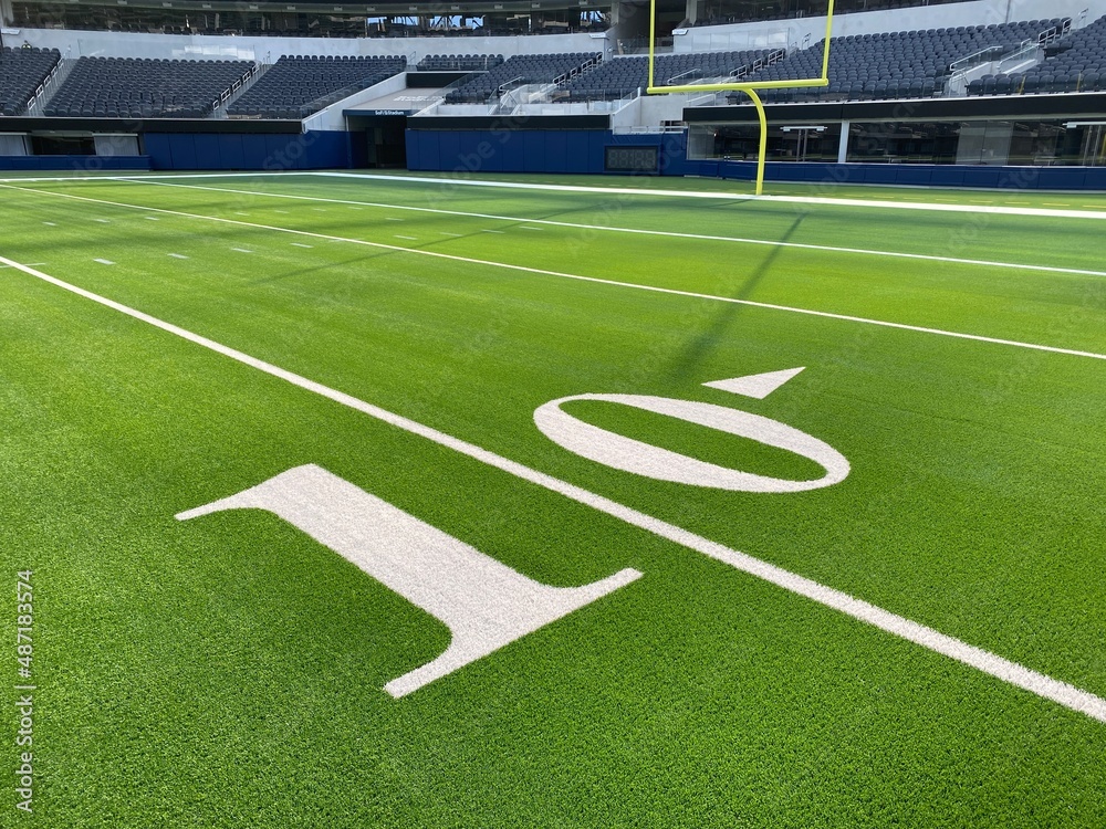 Fototapeta premium American football field, empty, no crowd with yard line numbers. 10 yard line.
