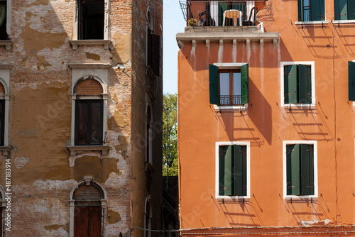 Deteriorated building besides a refurbished one, Venice, Italy