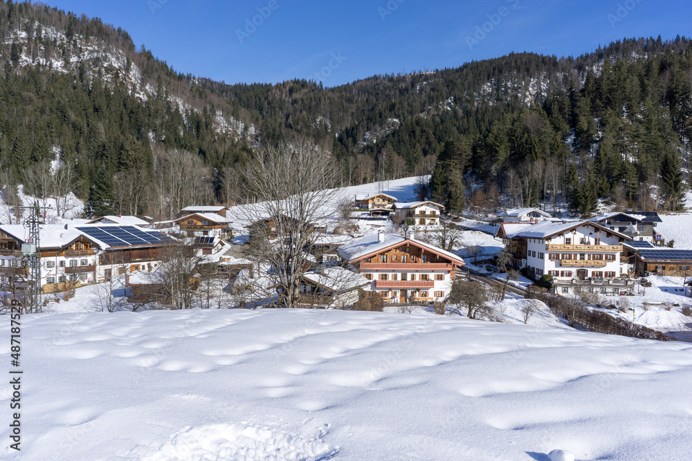 houses of a mountain village during winter with a lot of snow