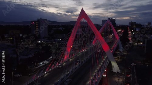 evening flying counter clockwise around Matute Remus Bridge in Guadalajara Mexico photo