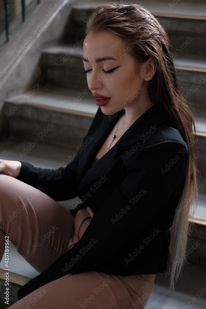 Portrait of a young girl. Elegant and melancholy portrait. Beautiful woman in classic clothes
Portrait of a young girl. Elegant and melancholy portrait. Beautiful woman in classic clothes