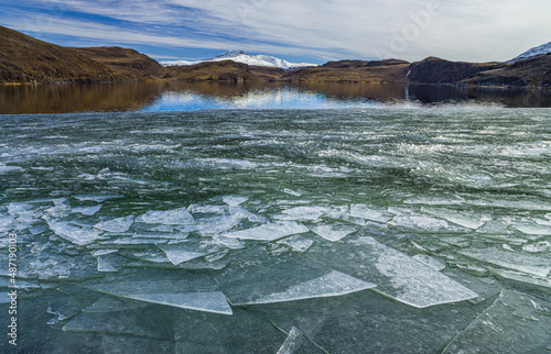 Winter in Patagonia: drift ice on a lake in the hills of Torres del Paine National Park, Chile 