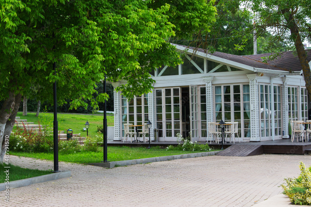 Naklejka premium Summer south street white cafe glass wall