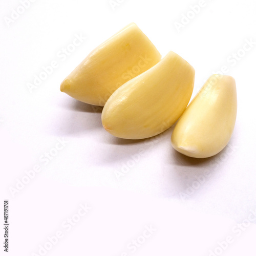 Fresh whole peeled garlic gloves isolated