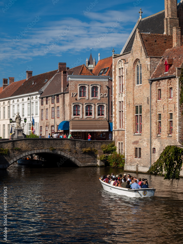 Tourist boat in Bruges canal