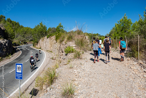 hikers on the dry stone route, GR221, Banyalbufar, Mallorca, Spain photo