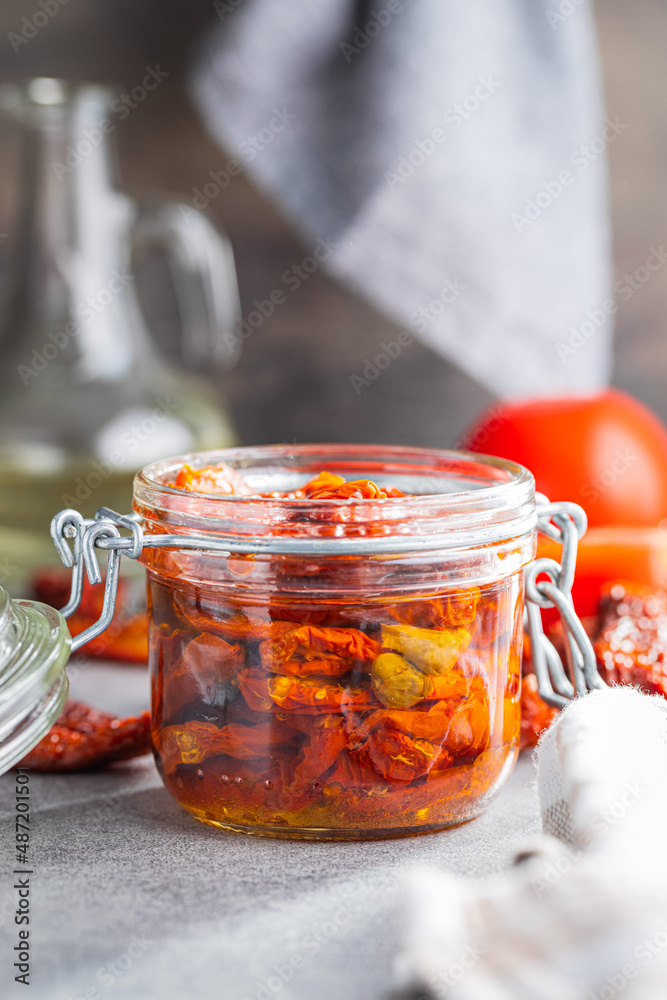 Sun dried tomatoe. Pickled tomatoes in jar. Sun dried tomatoe. Pickled tomatoes in jar.