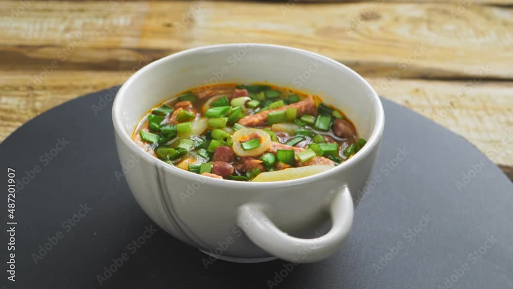 jewish cuisine bean soup cholit bean with tomato and smoked meats on the table spoon bread and kosher sausage. Circle rotation jewish cuisine bean soup cholit bean with tomato and smoked meats on the table spoon bread and kosher sausage. Circle rotation