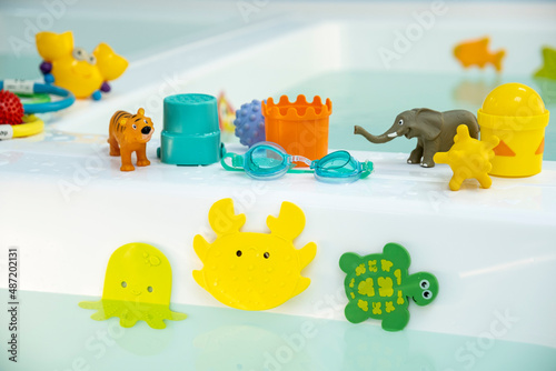 children's bath toys rubber on suction cups in the bathtub with water