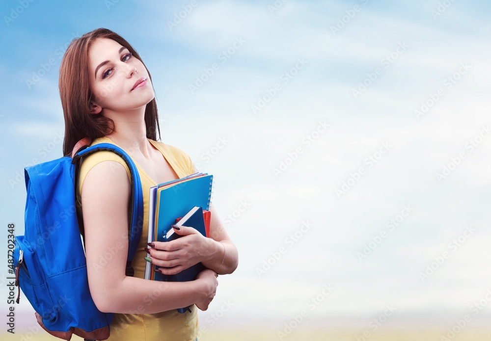Smart college student about to write an essay or homework Smart college student about to write an essay or homework