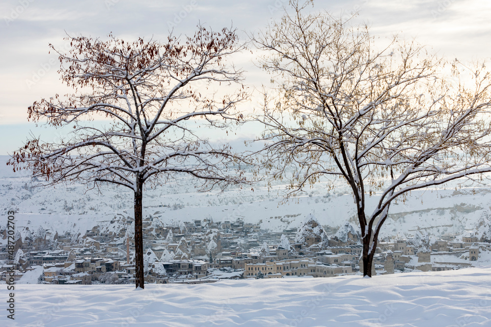 Pigeon Valley and Cave town in Goreme during winter time. Cappadocia, Turkey. Open air museum, Goreme national park. Heavenly landscape Pigeon Valley and Cave town in Goreme during winter time. Cappadocia, Turkey. Open air museum, Goreme national park. Heavenly landscape