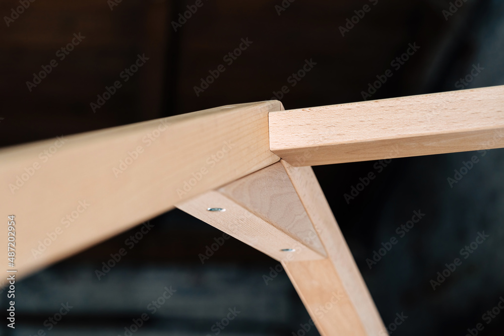 The image of the child's bed, plank joints, details against the backdrop of the black ceiling. The image of the child's bed, plank joints, details against the backdrop of the black ceiling.