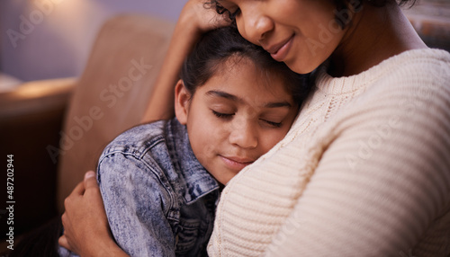 Spending quality time together. Shot of a mother and daughter at home.