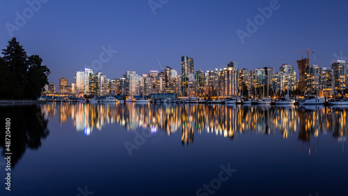 Panoramic view of Downtown Vancouver cityscape during sunset from Stanley Park sea wall  Vancouver  British Columbia  Canada