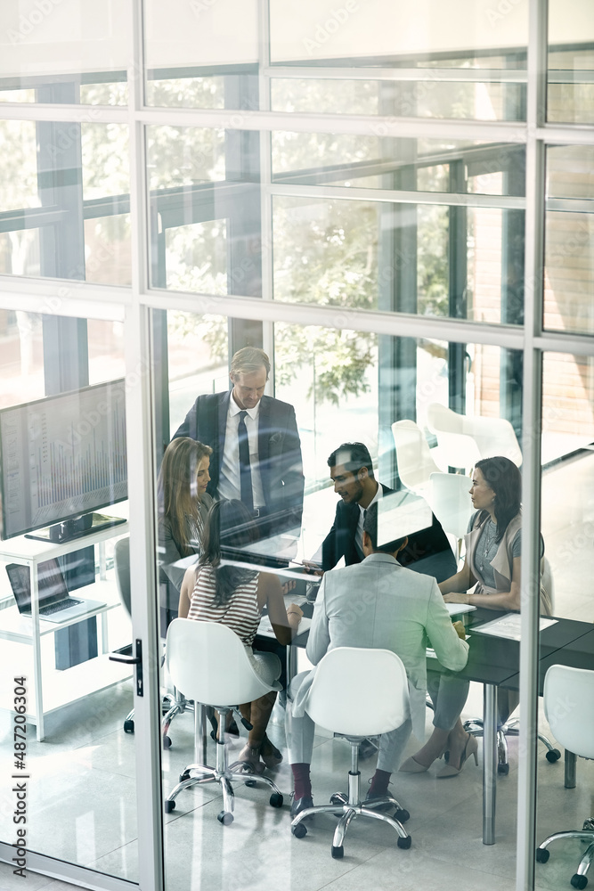 Presenting ideas to the team. Shot of corporate businesspeople meeting in the boardroom.