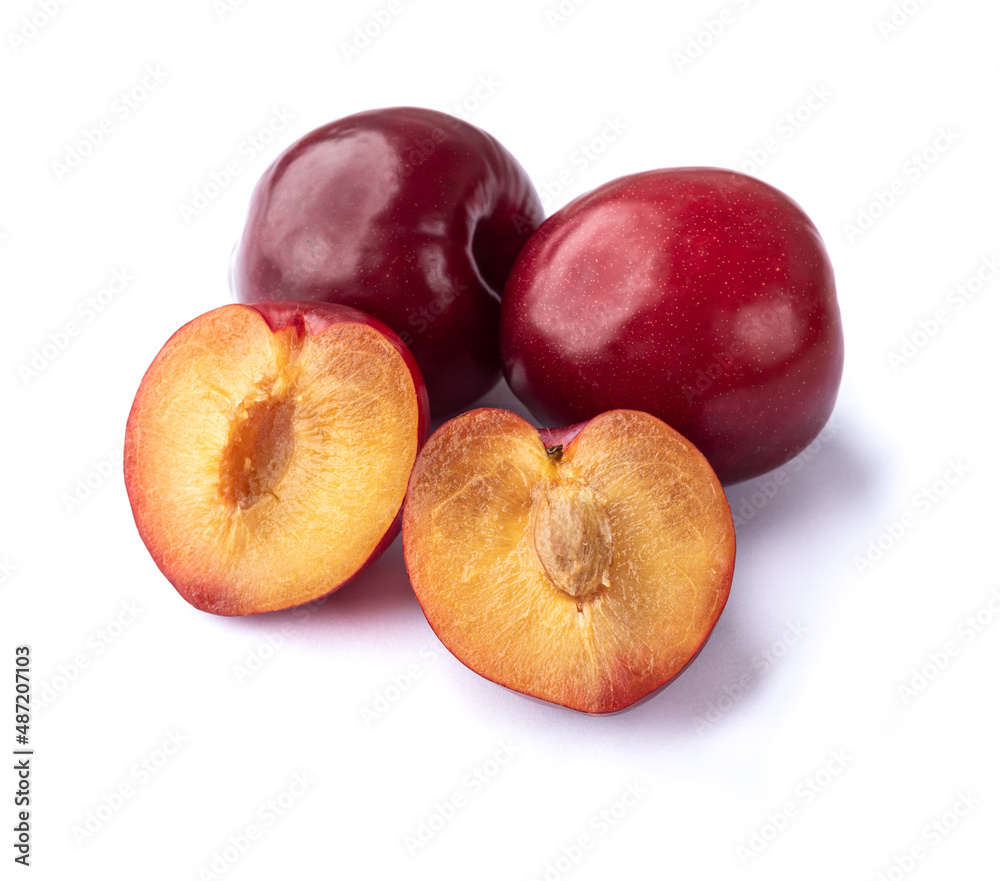 Plums with half fruit isolated over white background