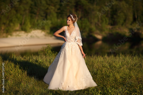 bride against the background of the river. High quality photo