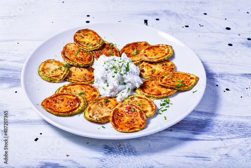 Fried zucchini slices with tzatziki