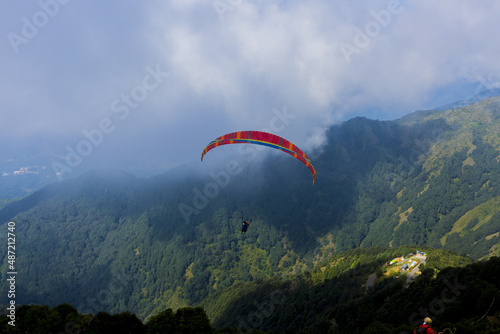 A famous paragliding site with tourists arrive to enjoy the paragliding, Palampur, India photo