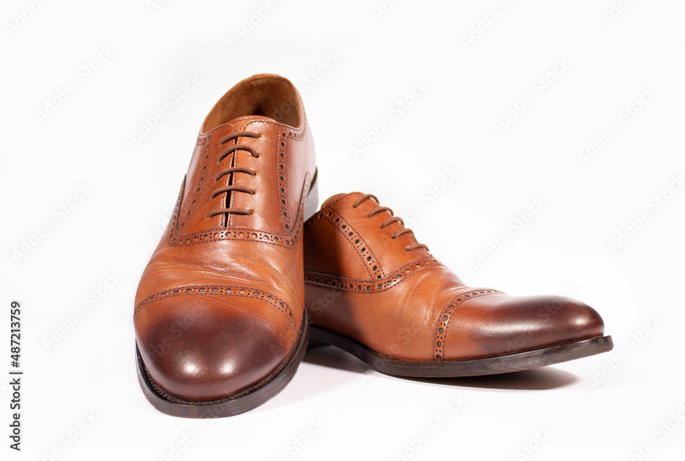 Men's brown shoes on a white background. Isolate. Beautiful men's shoes Men's brown shoes on a white background. Isolate. Beautiful men's shoes
