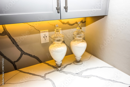 Kitchen Counter Top With Two Glass Containers photo