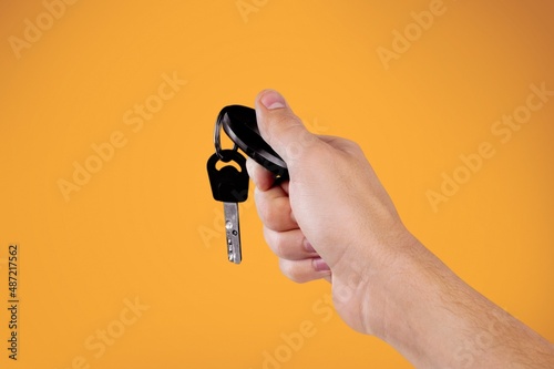 Hand showing giving car key as gift