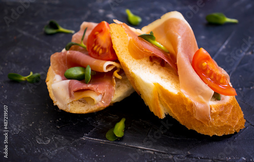 delicious sandwich with jamon, tomato