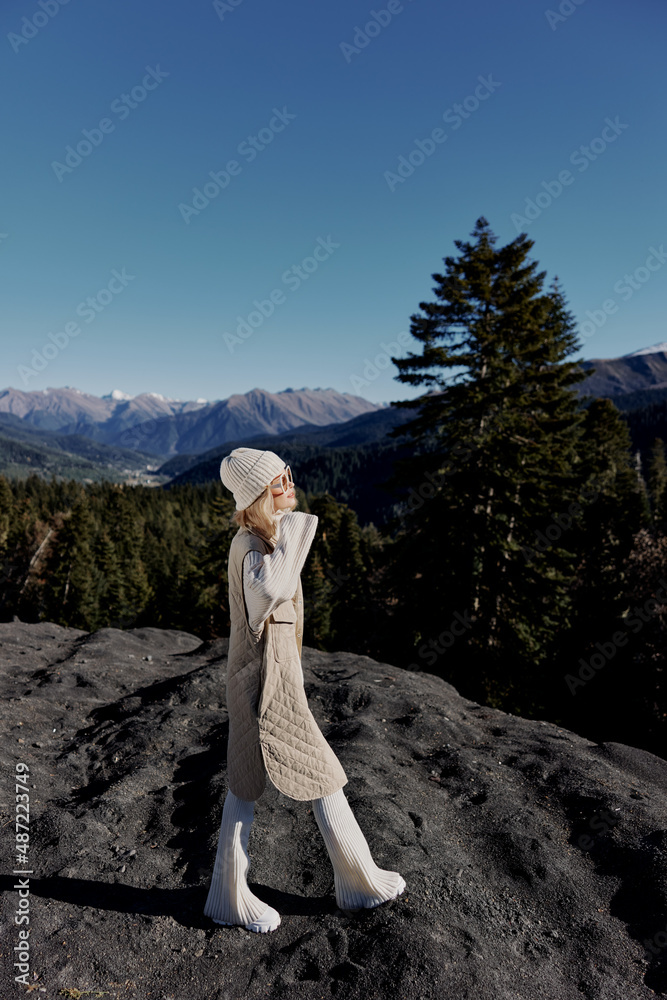Stylish woman Cliffs mountains fashion posing nature fresh air relaxation