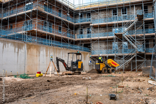 Construction works in progress at new residential building site photo