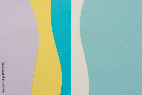 Wallpaper Mural paper design suitable as a background with blank space featuring undulating lines in mauve, yellow, and blue Torontodigital.ca