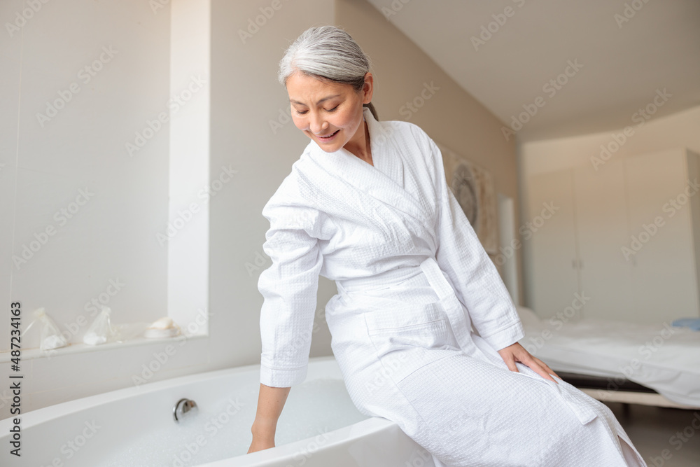 Pretty female getting ready to take bath Pretty female getting ready to take bath