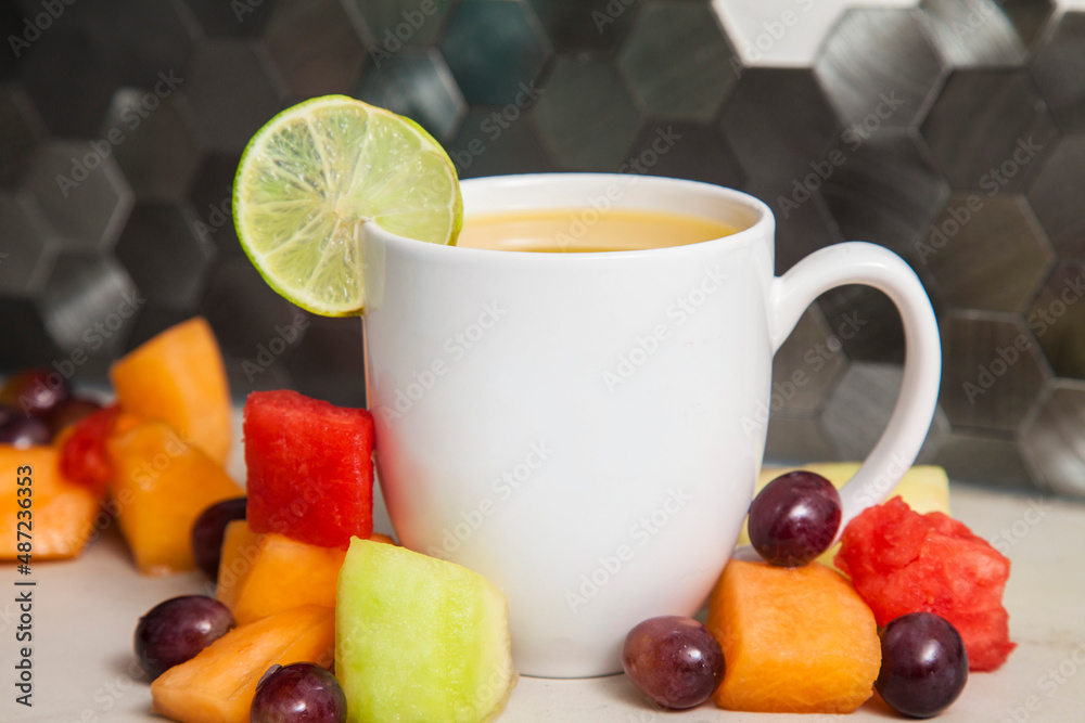 white porcelain coffee drink cup mug on kitchen counter with fresh fruit white porcelain coffee drink cup mug on kitchen counter with fresh fruit