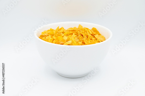 фотографія Corn Flakes, in a white bowl, isolated on a white background