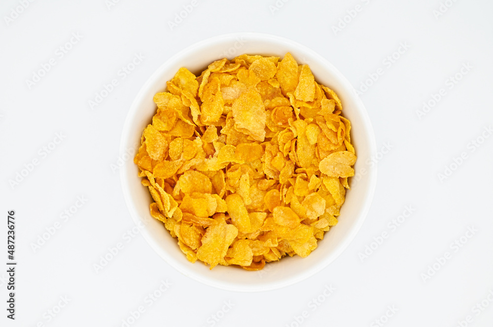 Corn Flakes, in a white bowl, isolated on a white background