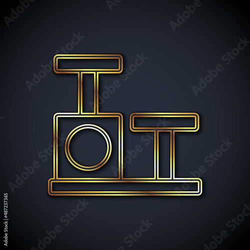Gold line Cat scratching post with toy icon isolated on black background. Vector