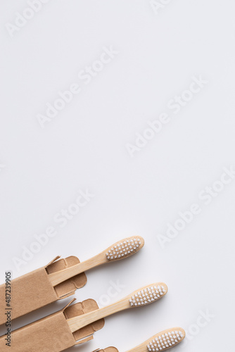 Set of ECO friendly wooden bamboo toothbrushes. Save the planet or NO plastic concept. Isolated on white background.