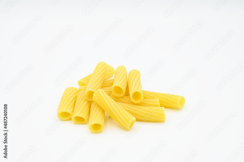 Raw Tortiglioni pasta, isolated on a white background Raw Tortiglioni pasta, isolated on a white background